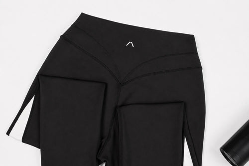 Black leggings with Aris brand logo on a white background