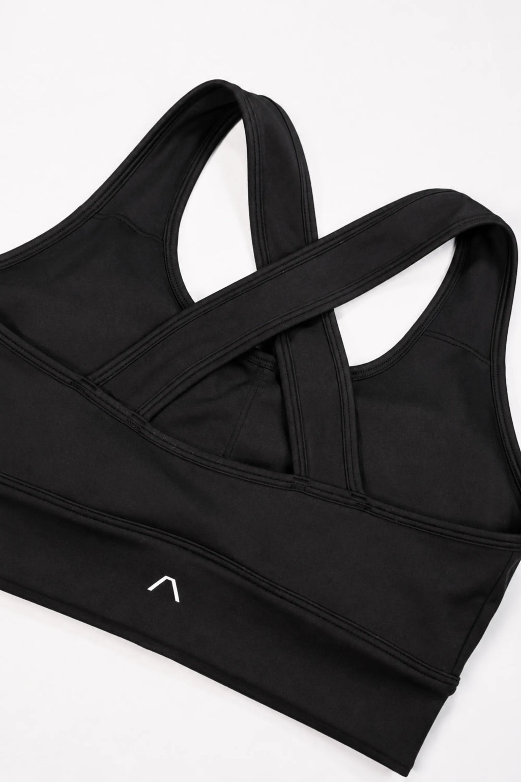 Back of sports bra with ARIS logo visible