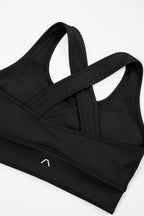 Back of sports bra with ARIS logo visible