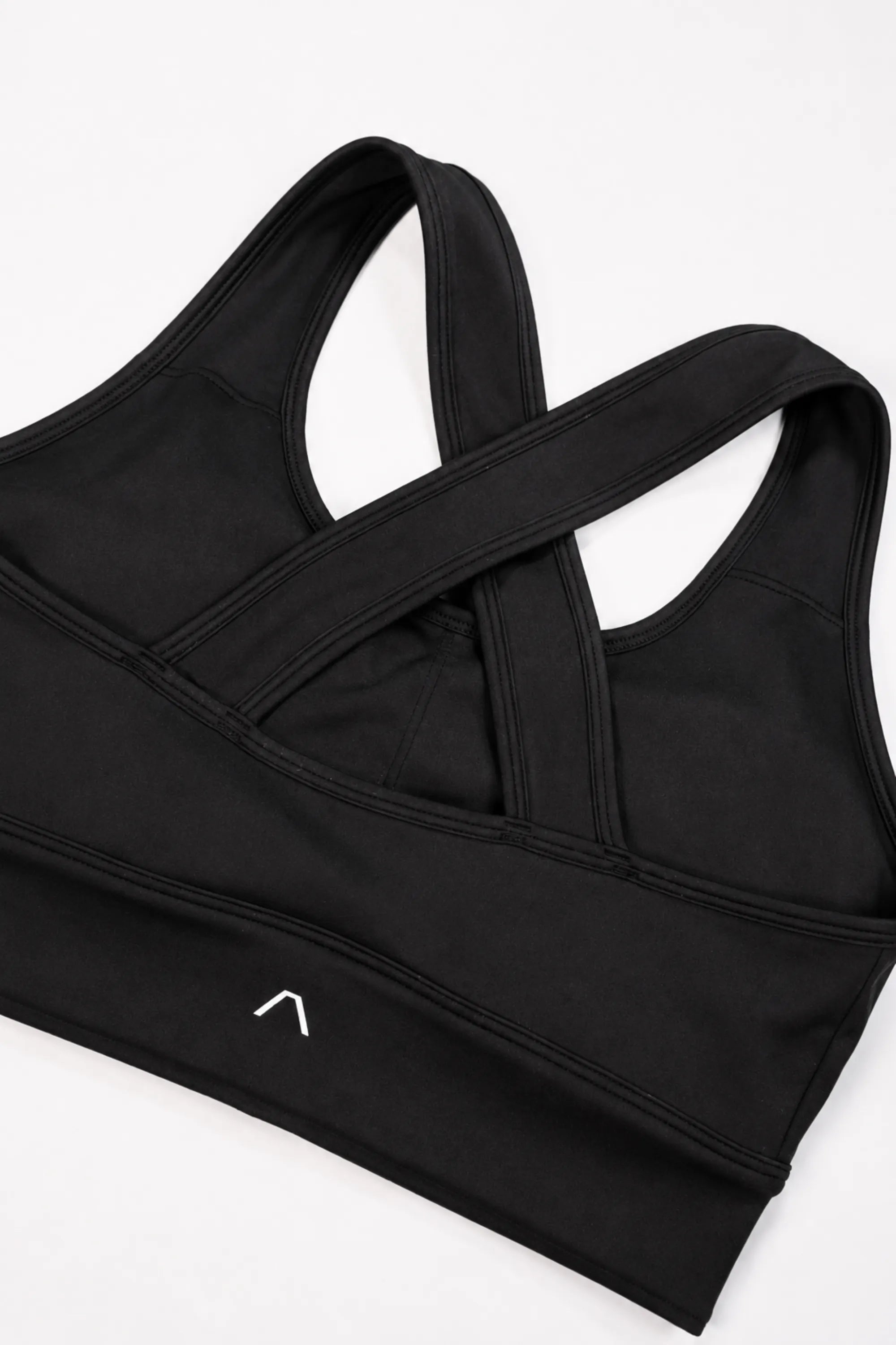 Back of sports bra with ARIS logo visible
